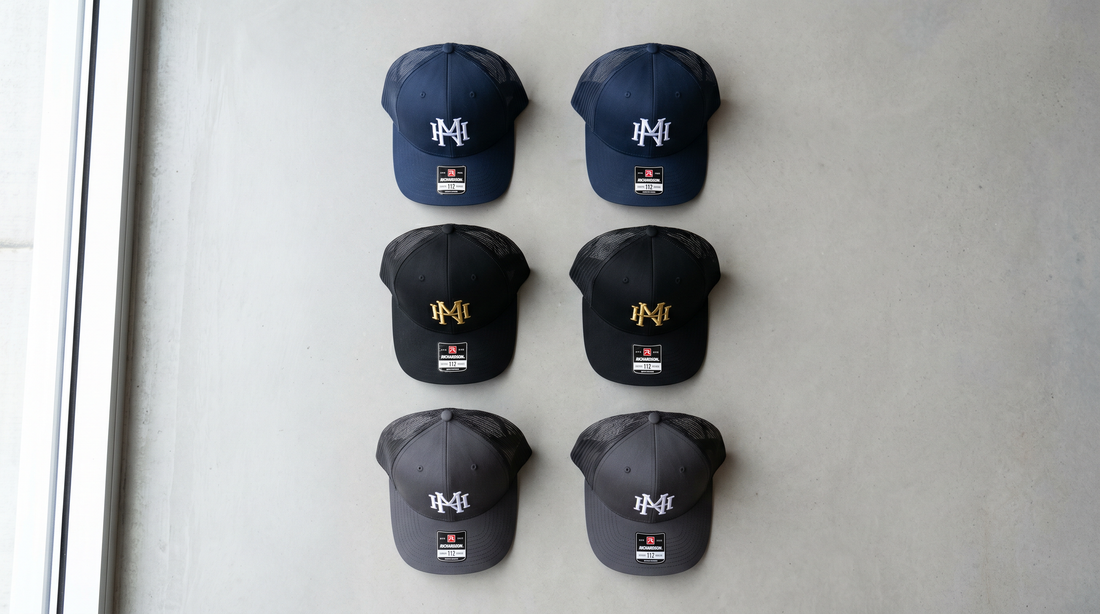 Custom embroidered trucker hats flat lay for bulk business orders