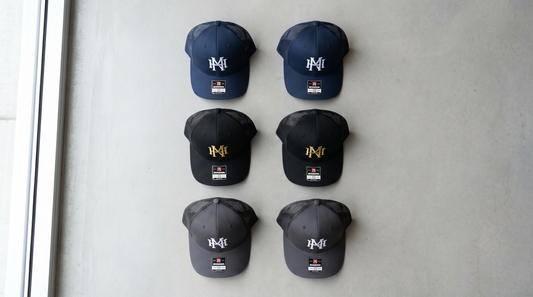Custom embroidered trucker hats flat lay for bulk business orders