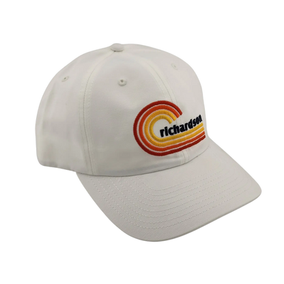 White cap with a colorful 'Richardson' logo on a white background